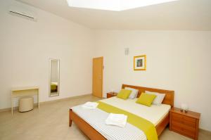Postel nebo postele na pokoji v ubytování Villa Luna