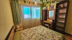 a bedroom with a bed and a window at Harmony in Sveti Vlas