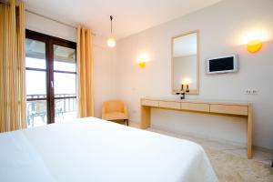Postel nebo postele na pokoji v ubytování Meteora Hotel at Kastraki