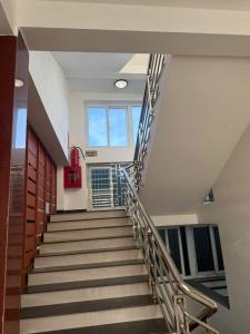 a spiral staircase in a building with a stair case at G7 Hotel in Quyền Hoành