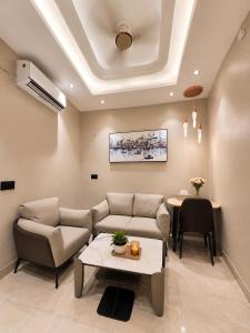 a living room with a couch and a table at SriVa Nest in Ghaziabad