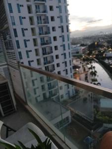 a view from the balcony of a large apartment building at Condo in Mactan Newtown in Lapu Lapu City