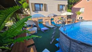 an image of a pool with a water slide at Miuti Residence in Triberg