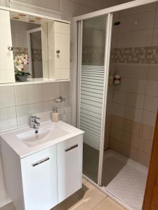 a white bathroom with a sink and a shower at Love Holiday Suite 2 in Tris Elies +39 photos