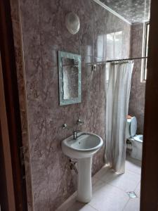 a bathroom with a sink and a toilet at Shekvetili Babi in Shekhvetili +54 photos