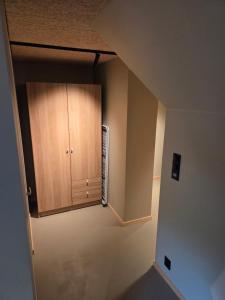 a kitchen with a cupboard in a room at Lofoten Apartment 01 in Leknes