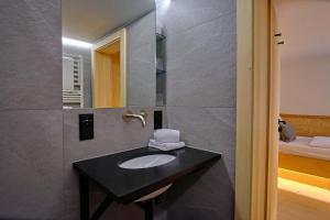 a bathroom with a sink and a mirror at Forsthaus Valepp in Schliersee +37 photos