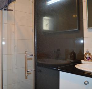 a bathroom with a sink and a mirror at Marina in Čapljina