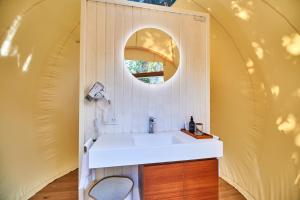 a bathroom with a sink and a mirror at Astral Tulum in Tulum