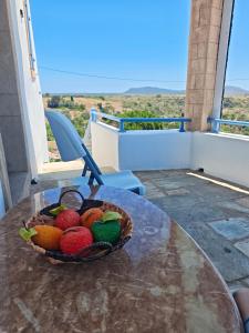 a basket of fruit on a table on a table at Kastri in Kythira