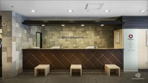 a restaurant with a counter and two stools at Daiwa Roynet Hotel Kobe Sannomiya in Kobe