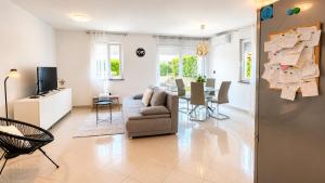 a living room with a couch and a table at K&D in Rijeka