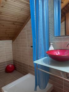 a bathroom with a red sink and a shower at Bochtis Acrogiali in Ammoudia +113 photos