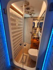 a bathroom with a shower with a toilet and a sink at Luxury Private Suite in Rhodes Town +3 photos