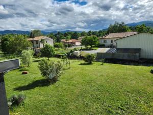 a view of a yard with houses and trees at Appartement in Lorp Sentaraille