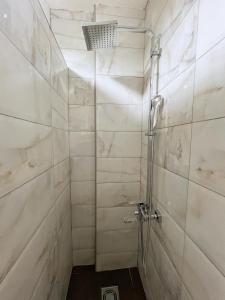 a shower with a glass door in a bathroom at Green Paradise in Vrnjačka Banja +31 photos