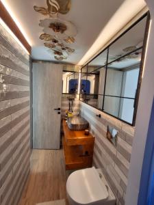 a bathroom with a sink and a toilet at Luxury Private Suite in Rhodes Town