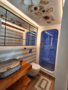 a bathroom with a tub and a toilet at Luxury Private Suite in Rhodes Town