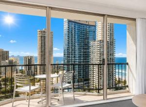 a balcony with a table and chairs and a view of the ocean at L19 Ocean View Suite - King Bed Wi-Fi in Gold Coast