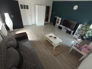 a living room with a couch and a table at Ewula in Giżycko