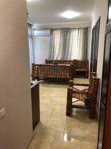 a living room with a couch and chairs in a room at Квартира in Ureki