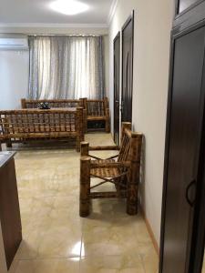 a living room with two chairs and a couch at Квартира in Ureki +8 photos