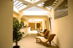a lobby with a row of chairs and a table at Hotel Terme Marine Leopoldo II TERME & SPA in Marina di Grosseto