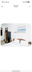 a bedroom with a bed and a large mirror at The courtyard Zanzibar in Ngambo