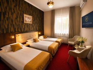 a hotel room with two beds and a window at Hotel Galicja SPA Wieliczka in Wieliczka +161 photos
