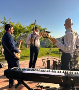a group of men playing music on a keyboard at Agriturismo La Terrazza su Farfa in Castelnuovo di Farfa +243 photos