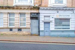 a building with two doors on the side of a street at Studio Apartment Fully Equipeed with WiFi and Netflix in Ilkeston