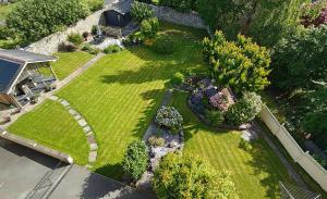 an aerial view of a backyard with a garden at Llys Bach Apartment at Llys Aeron in Aberaeron +28 photos