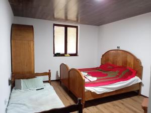 a bedroom with two beds in a room at Etno Han crvena reka in Bela Palanka
