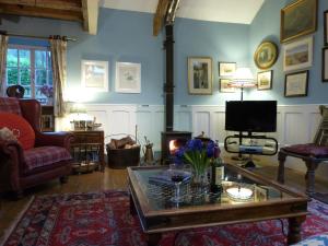 TV a/nebo společenská místnost v ubytování Ty Isaf