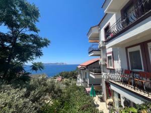 a view of the ocean from a building at Heybe Apart in Kaş