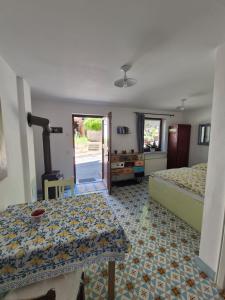 a bedroom with two beds and a table in it at Ferienappartement Tal der Liebe in Sauerthal