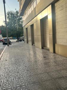 a brick sidewalk in front of a building at Modern Studio in Kenitra