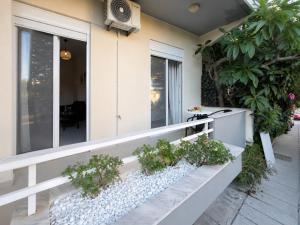 a house with plants on the front porch at Linda's Apartment in Ialysos
