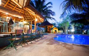 a resort with a swimming pool and a bar at Boa Gente Lodge in Vilanculos +51 photos