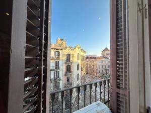 a view of a city from a balcony at Consell Habitaciones in Barcelona