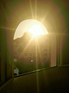 a view of the sun through a window at Bella Javea in Jávea