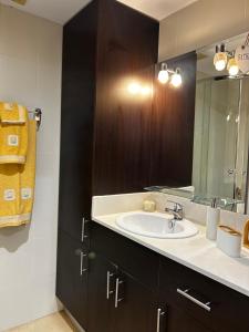 a bathroom with a sink and a mirror at Bella Javea in Jávea