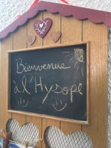 a chalkboard with a sign that says bannannine and hippop at L'Hysope Gap, Maison d'hôtes contemporaine avec vue in Gap
