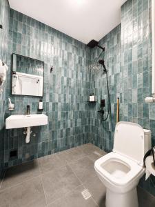 a bathroom with a toilet and a sink at Complex DEL MAR in Chakvi +17 photos