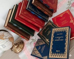 a pile of books sitting on top of a table at Locri27 Apartment in Catanzaro Lido