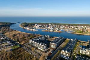 an aerial view of a city and a river at Navy Blue Apartment - SPA - Basen - Parking in Dziwnów