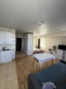 a living room with a couch and a table at Smart House Home in Kyiv