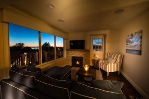 a living room with a couch and a fireplace at The Newport Lofts - 617 Thames Street in Newport