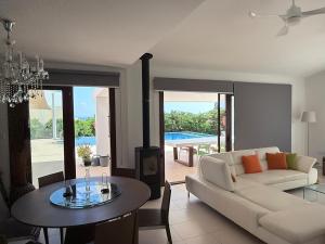 a living room with a couch and a table at The Sea Breeze in Paralimni