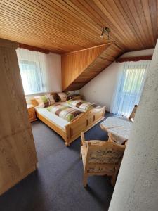 a bedroom with a large bed in a room at Pension Schöne Aussicht in Witzenhausen